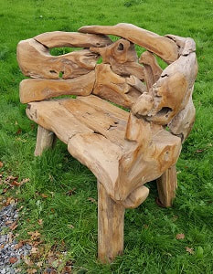 driftwood bench on grass